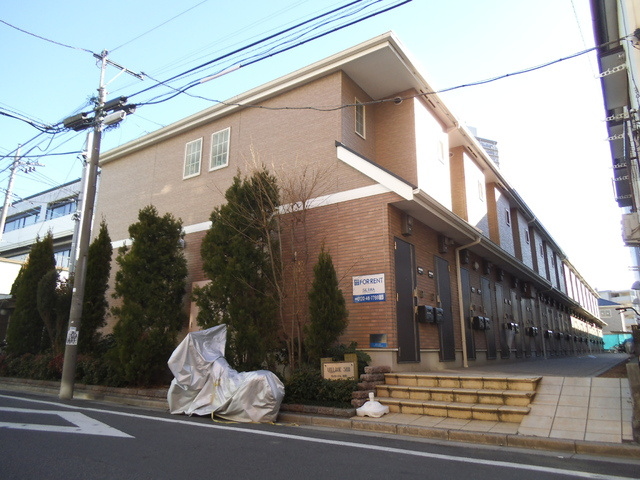 ヴィラージュ志伊の外観|ブラウンのおしゃれなタイル貼りの建物です