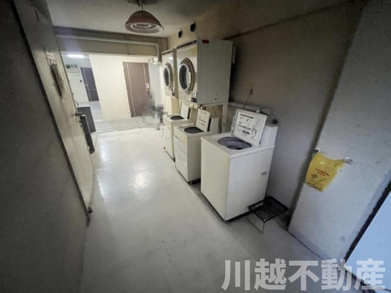 事務所に投資用に最適な好立地マンションのランドリースペース|居住者が誰でも使えるコインランドリー