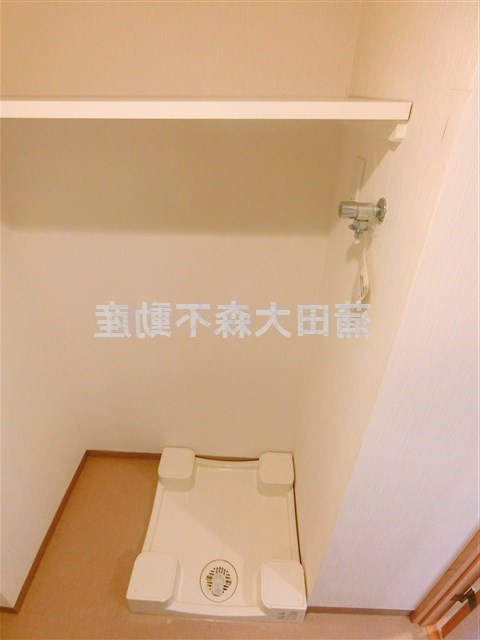 パティーナ大森の設備|棚付きの洗濯機置き場