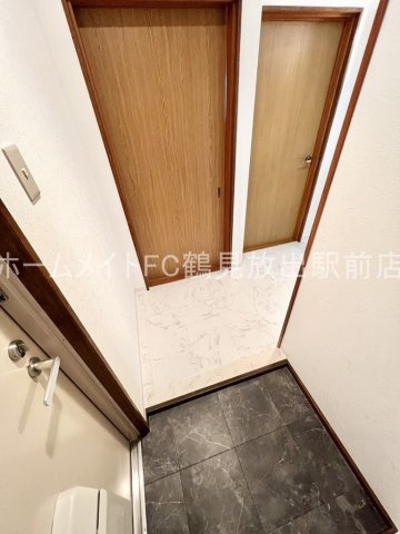 大阪市城東区鴫野東３丁目の賃貸マンションの玄関