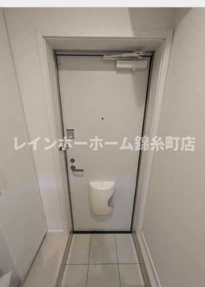 リーヴェルポート四ツ木Ａｘｉｓの玄関