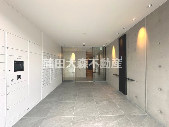 ZOOＭ蒲田EASTのエントランス|防犯カメラTVモニター付オートロック宅配BOXメールBOX管理人室