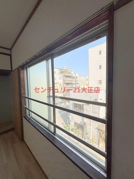 大阪市港区市岡元町２丁目の賃貸マンションの洋室
