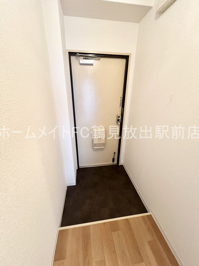 大阪市鶴見区放出東１丁目の賃貸マンションの玄関
