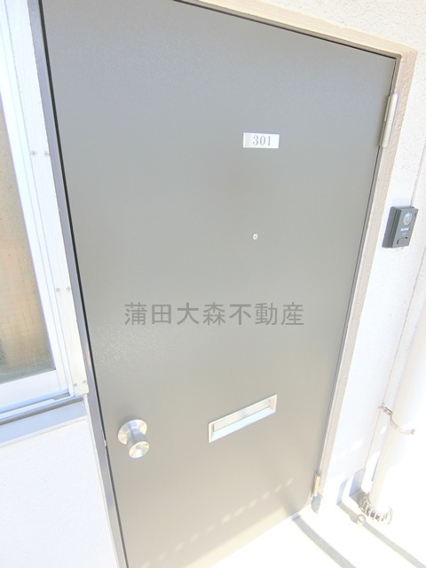 萩中マンションの玄関