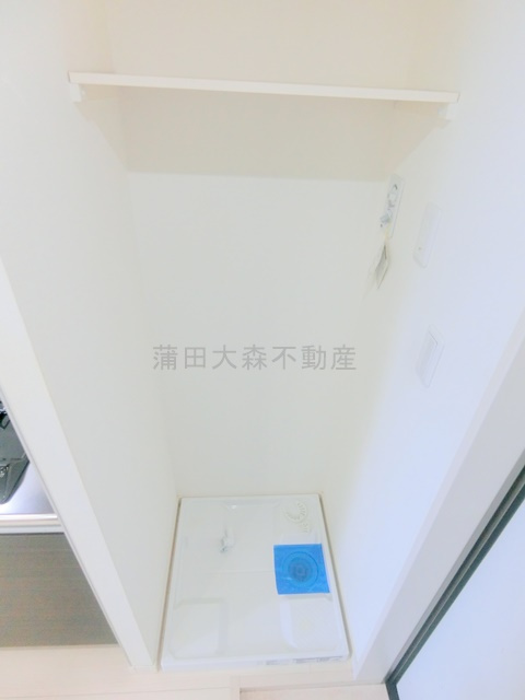 バロス大森の設備|玄関横室内洗濯機置き場
