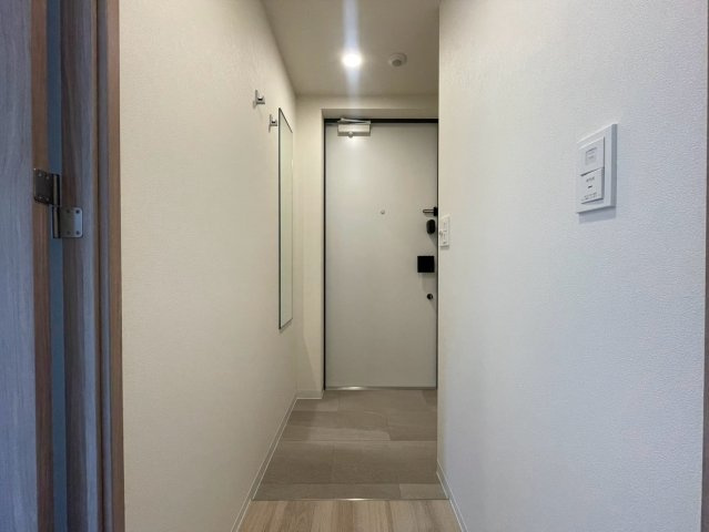 コンフォリア・リヴ本町WEST　Qの玄関