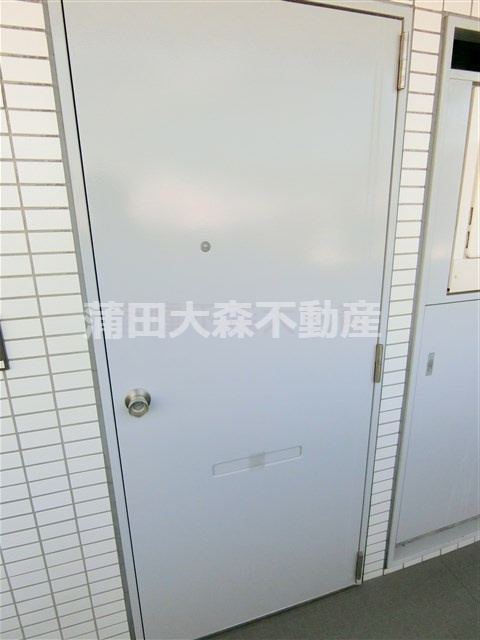 グローリア初穂池上の玄関