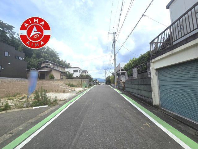 福岡市東区八田3丁目第12-2棟（1号棟）の外観|前面道路含む現地の写真です。
