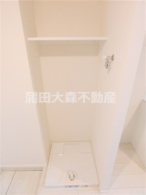 MAXIV北糀谷の設備|棚付きの洗濯機置き場　