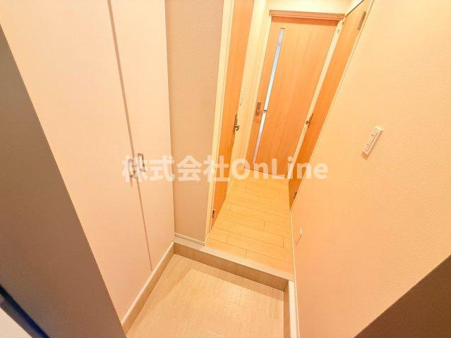 八尾市明美町２丁目の賃貸マンションの玄関