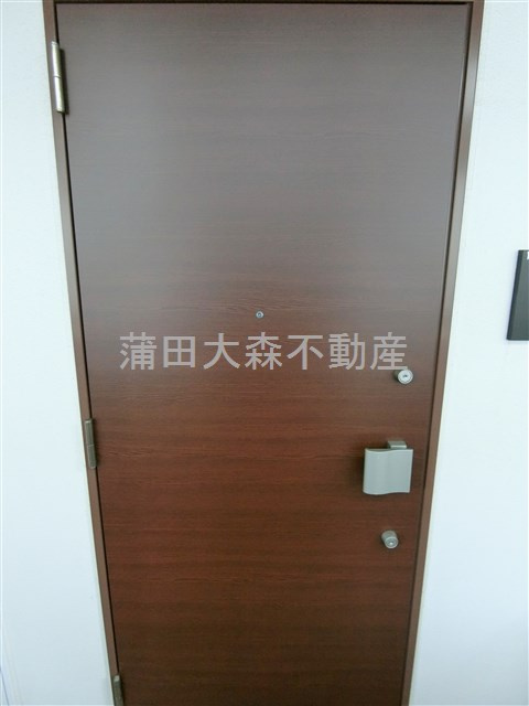 L'axeラグゼ本羽田の玄関