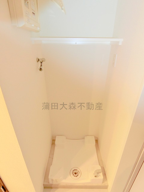 スパシエ蒲田グランドタワーの設備|棚付き洗濯機置き場