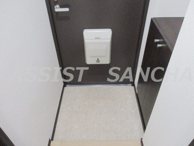 綴マンションの玄関