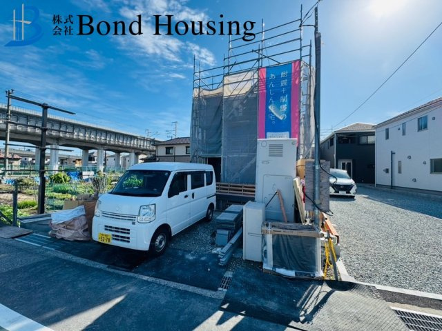 「オール電化」「全室南向き」西二見第23　1号棟の前面道路含む現地写真