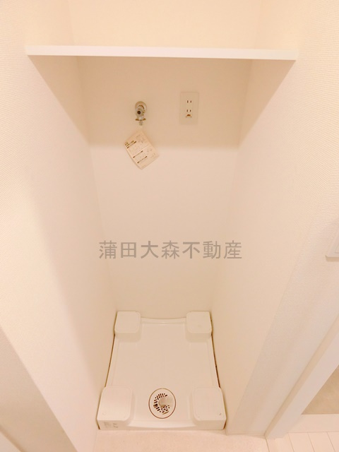 エステムプラザ蒲田TAKARABUNEの設備|棚付きの室内洗濯機置場