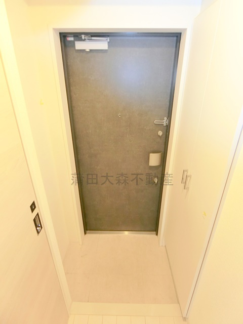 エステムプラザ蒲田TAKARABUNEの玄関