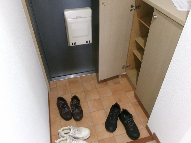フェリスメンテ狩口台の玄関
