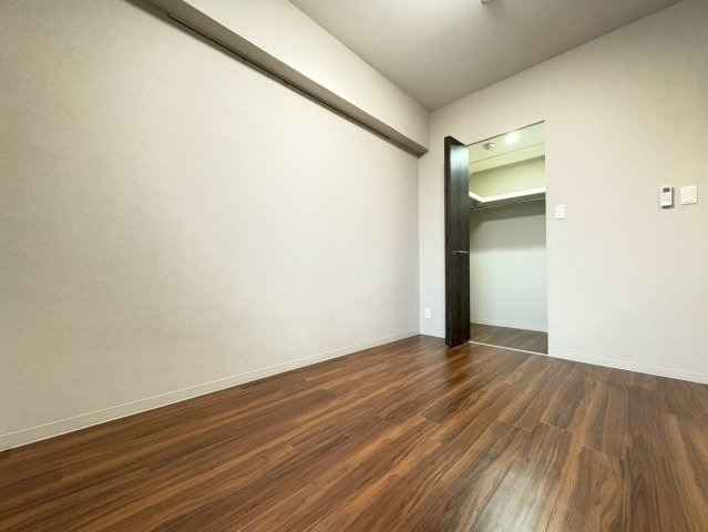 プレミアムコート千里丘の寝室
