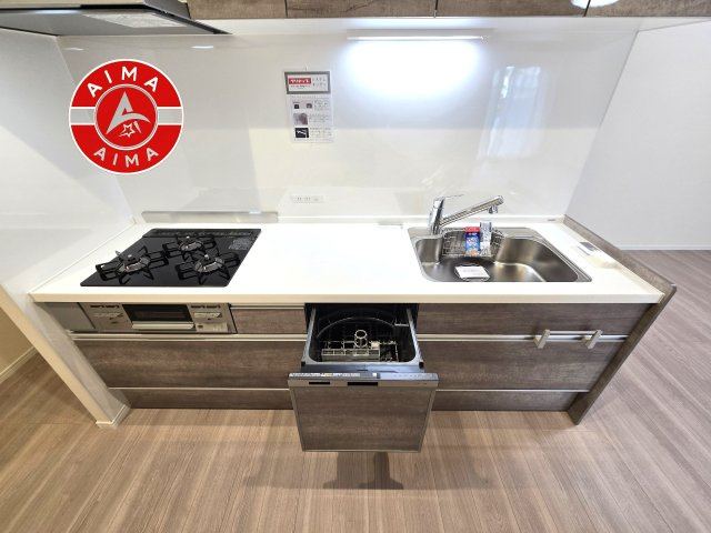 日商岩井リバーサイドマンションA棟のキッチン|リビングと一体感のある、明るくのびやかなオープンキッチン。
