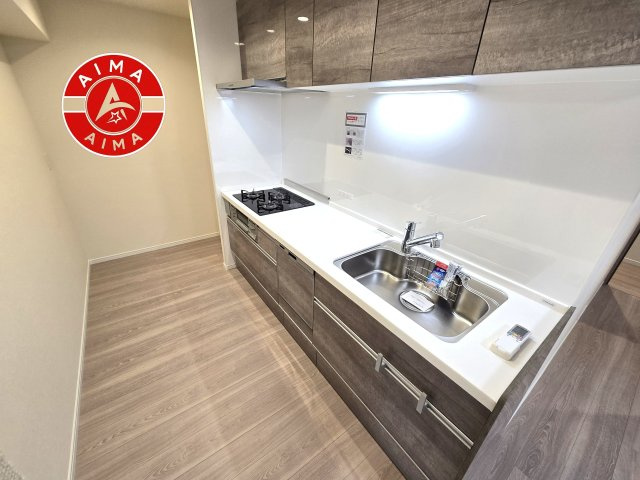 日商岩井リバーサイドマンションA棟のキッチン|ダイニングテーブルへの配膳がラクラク、お料理はかどるカウンター付きシステムキッチン！