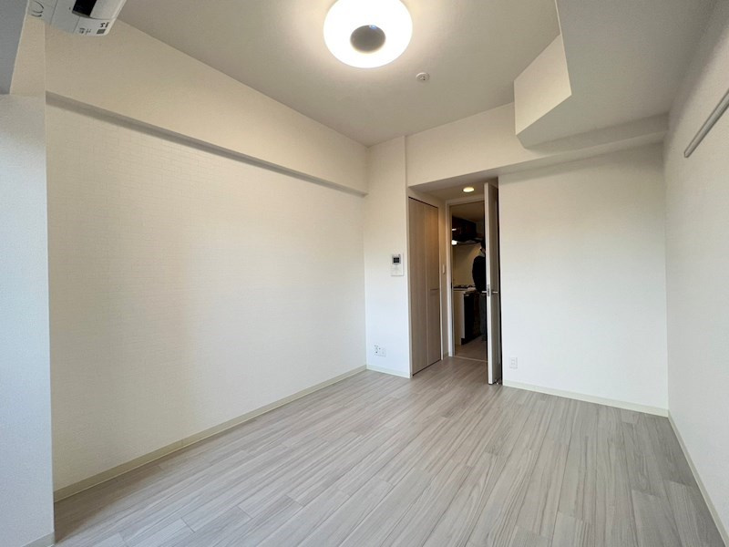 プレサンスOSAKA DOMECITY クロスティの寝室
