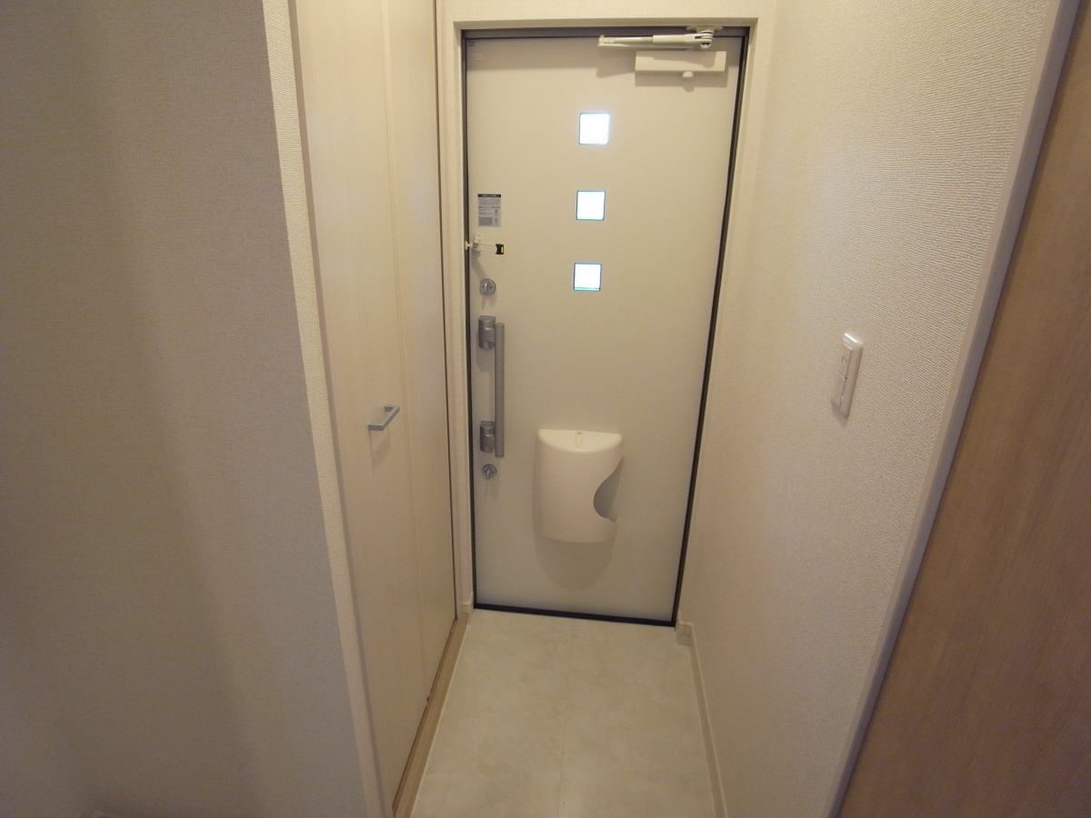 サンセール寝屋川の玄関