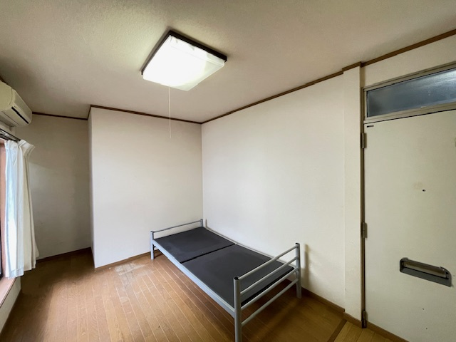 カレッジハウスニシガミⅢの寝室