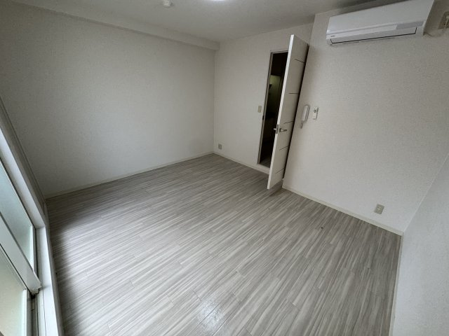 かねまつ庄内ビルの寝室