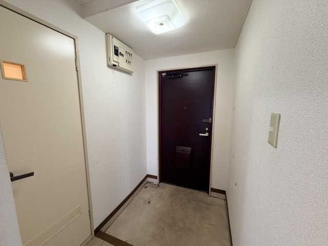 マンションつつみ起の玄関