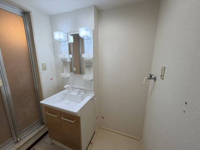 マンションつつみ起の洗面所