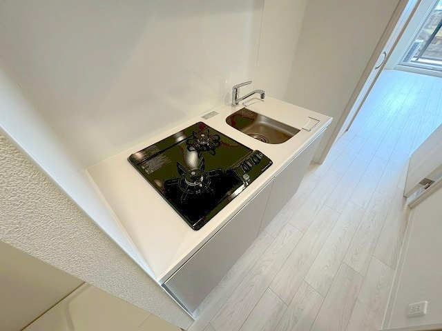 プレサンスNEO上新庄PRIMECRUISのキッチン