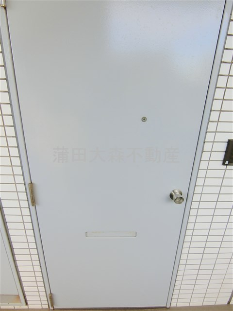 グローリア初穂池上の玄関