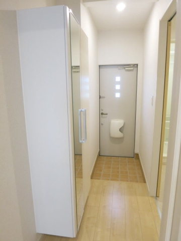 プルミエール信の玄関