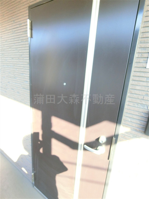 ロータス糀谷の玄関