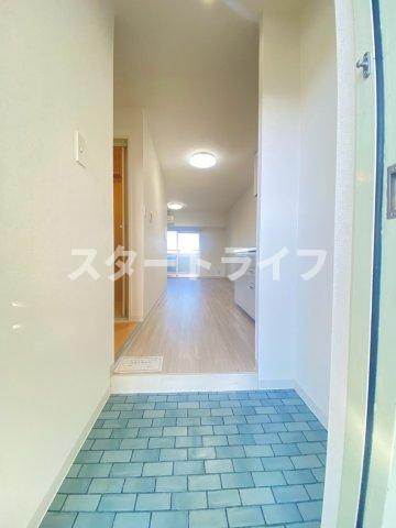 大阪市淀川区十三本町２丁目の賃貸マンションの玄関