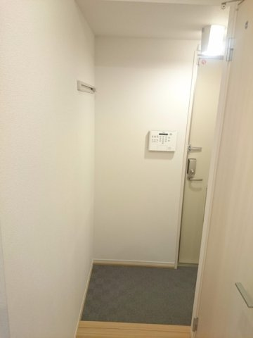コージィーコート大興の玄関
