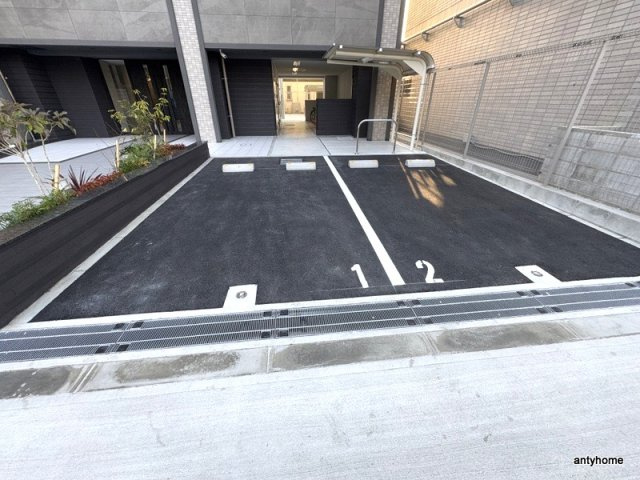 ファーストフィオーレ北大阪ミラージュ　仲介手数料無料の駐車場