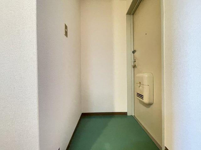 寝屋川市池田旭町の賃貸マンションの玄関