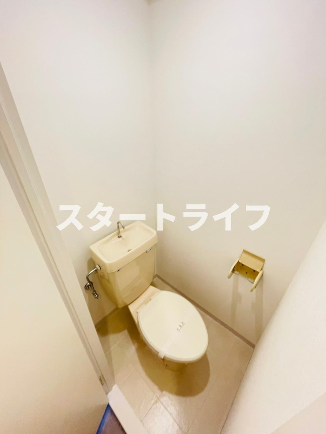 大阪市淀川区木川西１丁目の賃貸マンションのトイレ