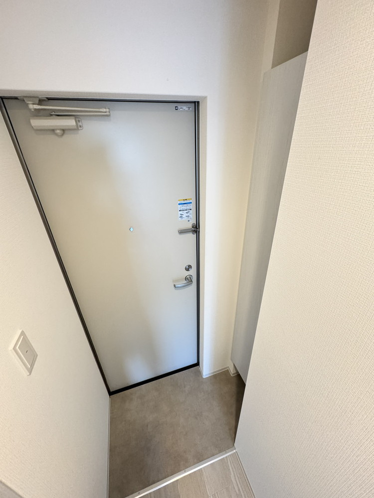 ジーメゾン柏原国分の玄関