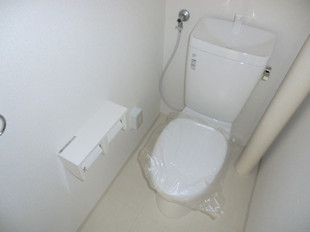 大阪市淀川区木川西１丁目の賃貸マンションのトイレ