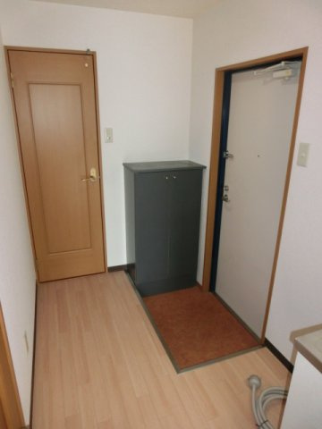 大阪市淀川区木川西２丁目の賃貸マンションの玄関
