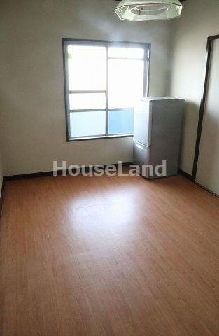 コーポサンライトの居間・リビング|落ち着いた色調の洋室です