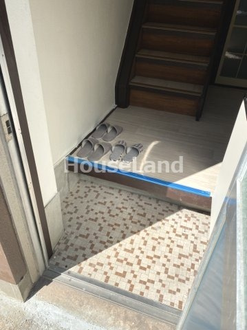 メゾン湊倉庫付住宅の玄関