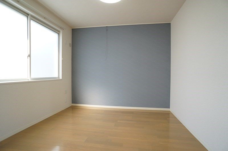 パルメゾンの寝室|アクセントクロスの洋室