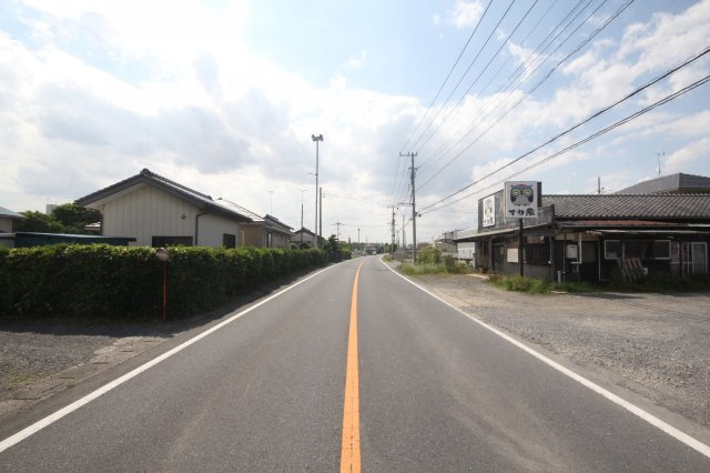 間口土地（１１８３番）の前面道路含む現地写真|県道阿佐間・幸手線（幅員：９.５ｍ～９.７ｍ）南東側より撮影