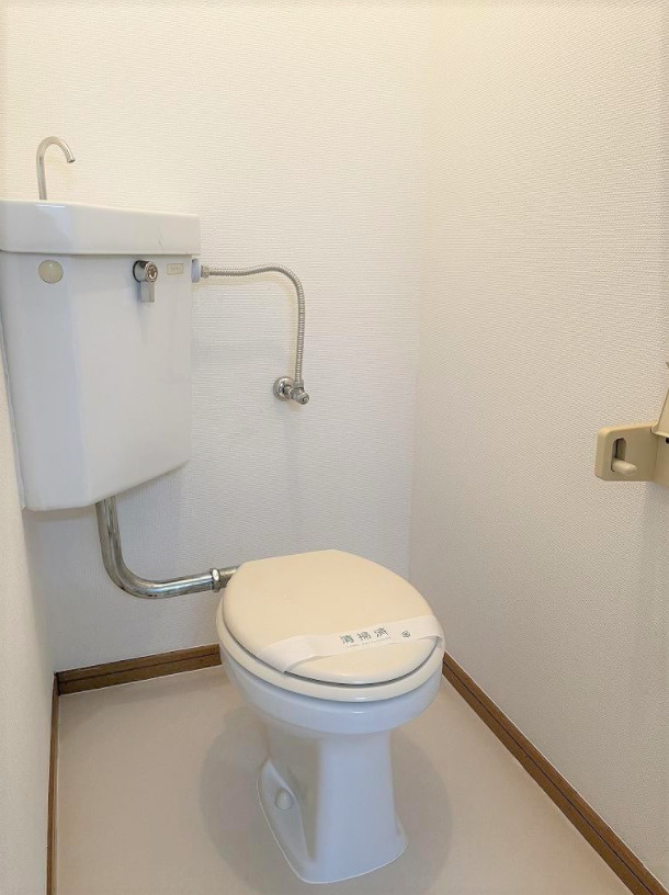 平成ビルのトイレ|落ち着いた色調のトイレです