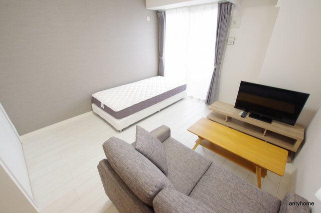 ファーストステージ江坂広芝町2　仲介手数料無料の居間・リビング