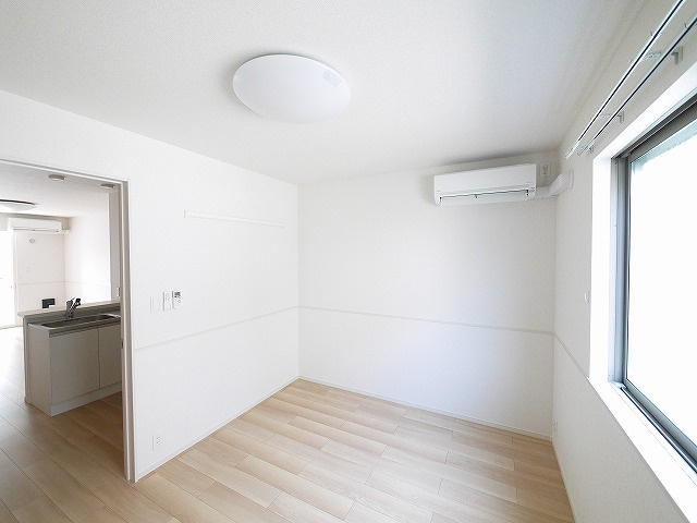 クレメント木津八ヶ坪Ｂの居間・リビング